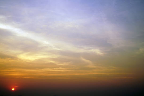 istock beautiful sunset on orange and blue color cloudy sky background 1132728909