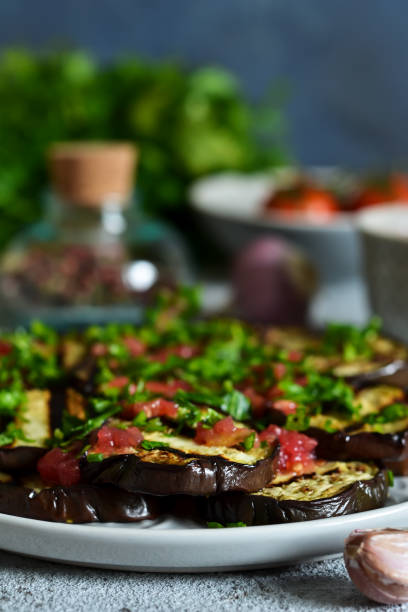 istock Spicy eggplant with tomato sauce and cilantro. Grilled eggplant. 1132729816