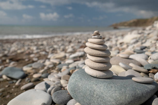 istock Pyramid of pebbles on the beach 1132730867