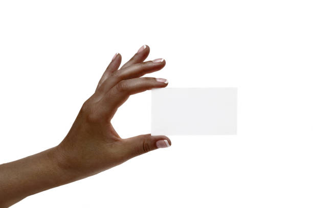 istock African female hand holds white card on a white background. 1132731611