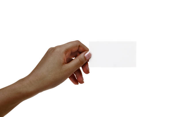 istock African female hand holds white card on a white background. 1132731631
