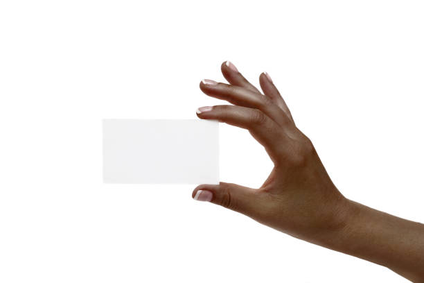 istock African female hand holds white card on a white background. 1132731708
