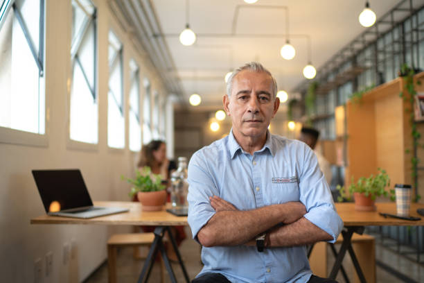 istock Confident senior chief leader portrait at work-studio 1132731764