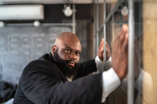 istock Frustrated afro man feeling loser standing near the window 1132731794