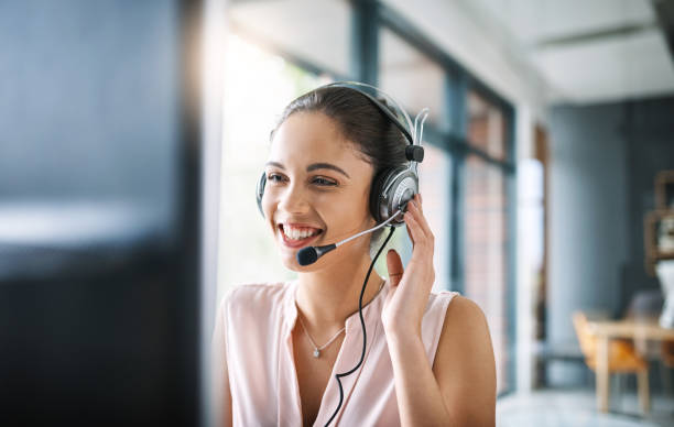 Helping others comes naturally Cropped shot of an attractive young woman working in a call center headset stock pictures, royalty-free photos & images