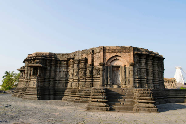 istock LONAR, BULDHANA DISTRICT, MAHARASHTRA, INDIA, November 2018, Devotee at  Daitya Sudan temple, left side view 1132731930
