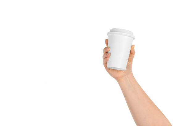 istock Female hand holding white coffee cup 1132732336