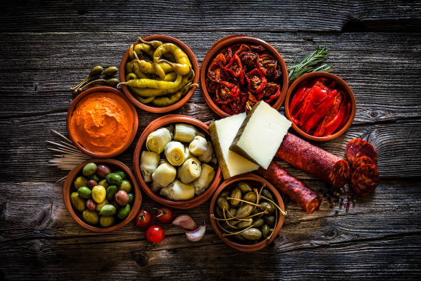 Tapas: typical spanish food shot from above on rustic wooden table