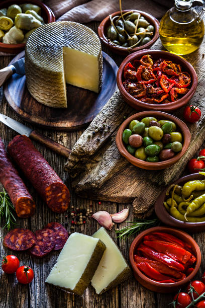 istock Tapas: typical spanish food on rustic wooden table 1132733381