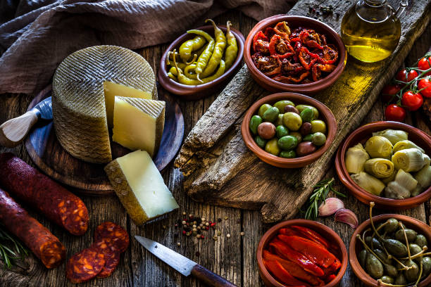 istock Tapas: typical spanish food on rustic wooden table 1132733383