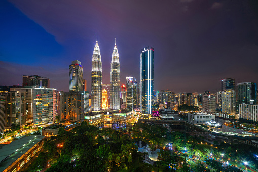 Aerial view of Kuala Lumpur Downtown, Malaysia. Financial district and business centers in smart urban city in Asia. Skyscraper and high-rise buildings at night.