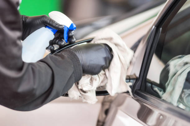 istock Hand with cloth cleaning the car glass. 1132739926