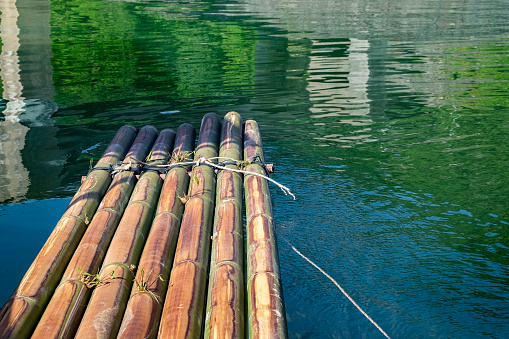 bamboo raft floating near the boathouse.boat is main transportation at Banding Lake located in Perak State, Malaysia