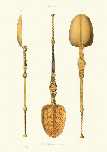 Vintage engraving of Crown Jewels of the United Kingdom, Coronation Spoon. The 27-centimetre-long (10.6 in) Coronation Spoon, which dates from the late 12th century, is silver-gilt and set with four pearls added in the 17th century. A ridge divides the bowl in half, creating grooves into which the Archbishop of Canterbury dips two fingers and anoints the monarch, confirming him or her as Supreme Governor of the Church of England.