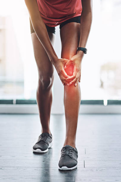 That really hurts Shot of an unrecognizable woman suffering from knee pain standing had to knee pose stock pictures, royalty-free photos & images