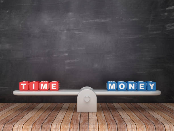 istock Seesaw Scale with TIME MONEY Cubes on Chalkboard Background - 3D Rendering 1132749456