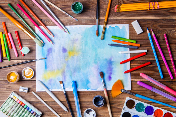 istock Painted paper, brushes, paints, colored pencils and prose stationery 1132753404