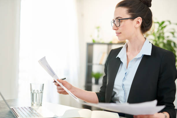 istock Successful Businesswoman Reading Documents 1132753641