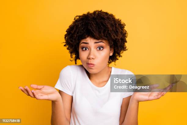 Closeup Portrait Of Her She Nice Attractive Puzzled Ignorant Wavyhaired Girl Showing Gesture No Information Isolated On Bright Vivid Shine Yellow Background Stock Photo - Download Image Now