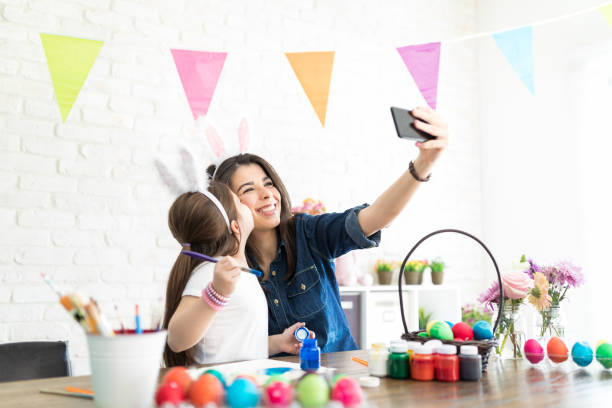 istock Creative Family Wearing Bunny Ears And Taking Selfie 1132758591