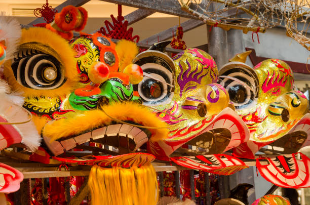 istock Traditional chinese lion dance head display on the shelves. 1132758979