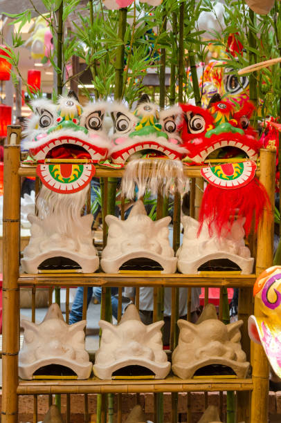 istock Traditional chinese lion dance head display on the shelves. 1132758984