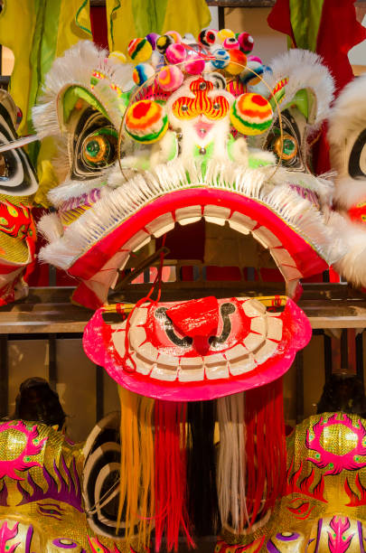 istock Traditional chinese lion dance head display on the shelves. 1132758987