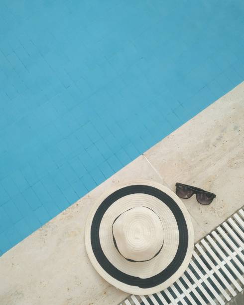istock Top view hat with glasses near the pool 1132760569