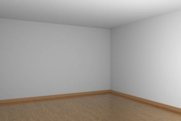 istock White empty room dark corner with brown hardwood parquet floor. 1132761449