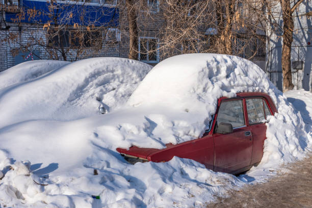 istock Car covered with snow in the spring 1132762880