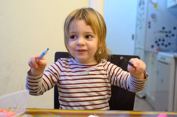 istock Little girl drawing at home 1132763784
