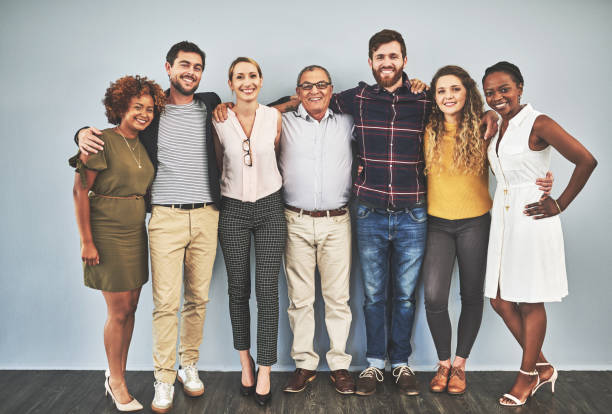 unity is what wins challenges - people in a row group of people in a row togetherness imagens e fotografias de stock