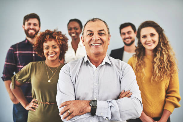 He has the best team behind him Shot of a group of businesspeople standing together organized group photos stock pictures, royalty-free photos & images