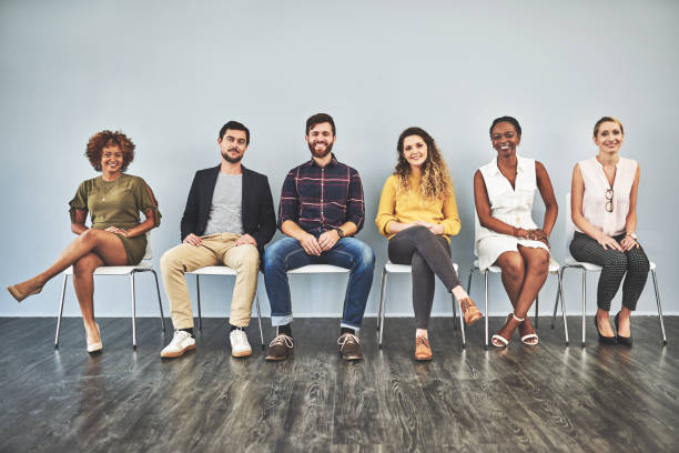 We all have something different to offer Shot of a group of businesspeople sitting in a row people in a row photos stock pictures, royalty-free photos & images