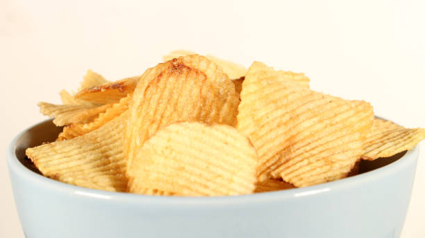 istock Potato Chips on White Close Up 1 1132766353