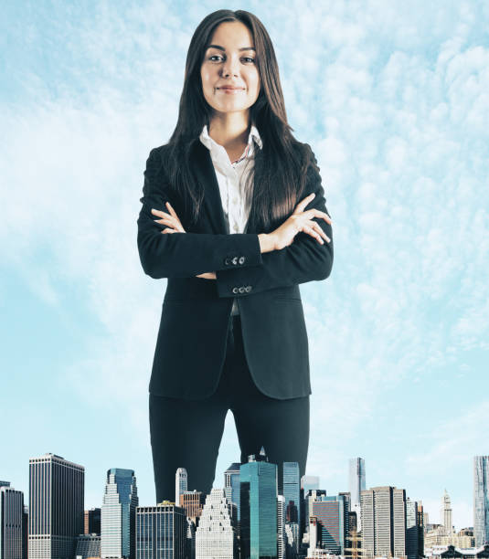 istock Happy giant businesswoman 1132766882