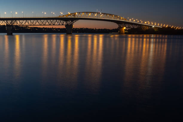 istock The Auckland harbour bridge lit up at night 1132768488