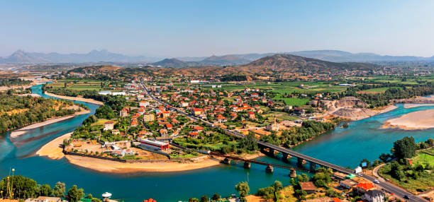 view at the valley of the river buna and bahcallek city from the rozafa castle, shkoder, albania. - grass church flood landscape imagens e fotografias de stock