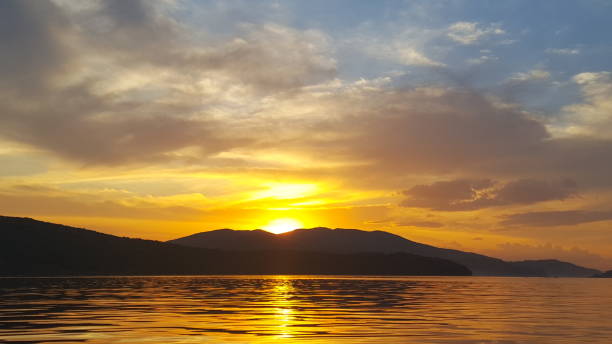 istock Bright sunset over the sea surface . Evening by the sea. Relaxation 1132770008