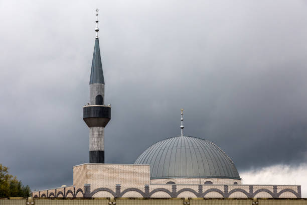 Amsterdam, netherlands, july 7,2025, taibah mosque rising in amsterdam, featuring stunning islamic architecture with minarets, a dome, and intricate details under a bright blue sky