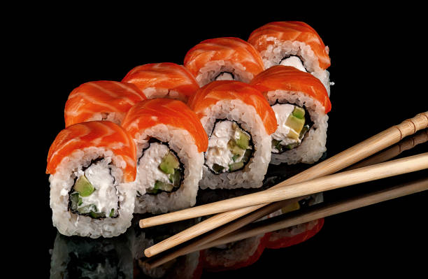 istock Sushi rolls Philadelphia with chopsticks 1132774587