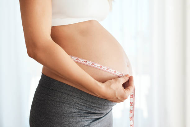 istock Inching her way to her due date 1132777619