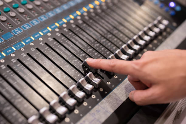 istock Hand using sound music mixer control panel in the event hall 1132778848