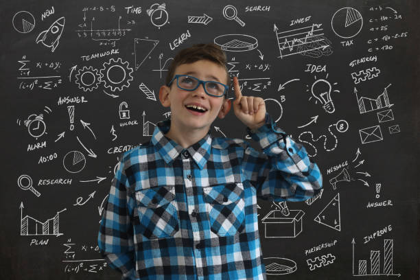 istock Boy child smile happy idea decision business strategy background blackboard 1132779156