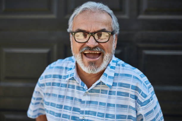 istock Happy senior man screaming outdoors 1132779176