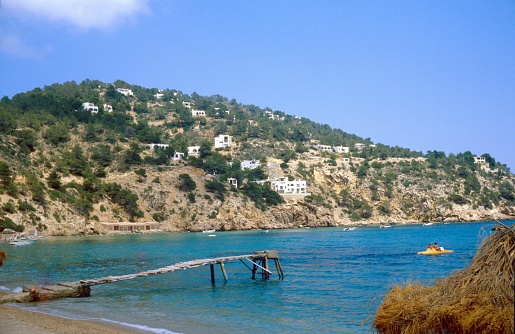 Ibiza, Balearic Islands, Catalonia, Spain, 1984. Bay with beach on the holiday island of Ibiza.