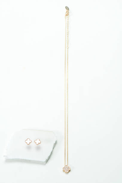 istock Gold necklace with gold earrings 1132780912