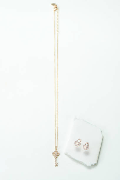 istock Gold necklace with gold earrings 1132780915