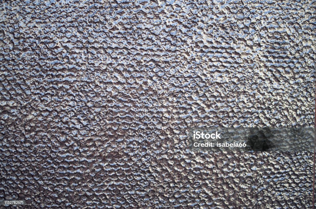 Glossy brown relief cladding tiles on wall closeup Art Stock Photo