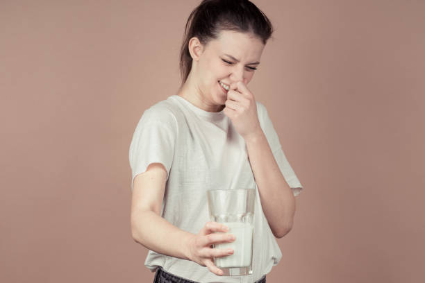 istock cute girl like hate milk 1132782710